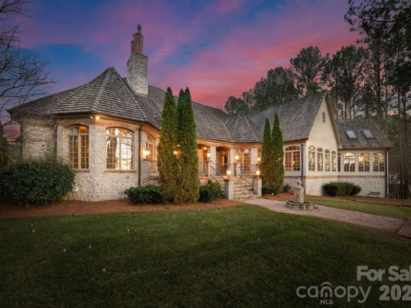 1515 Baltusrol Drive, Denver, NC 28037.  MLS# CAR4224856, YatesRealty ID 28621. Access the Manicured Rear Yard from the Expansive Flagstone Porch with Covered and Open-Air Space.