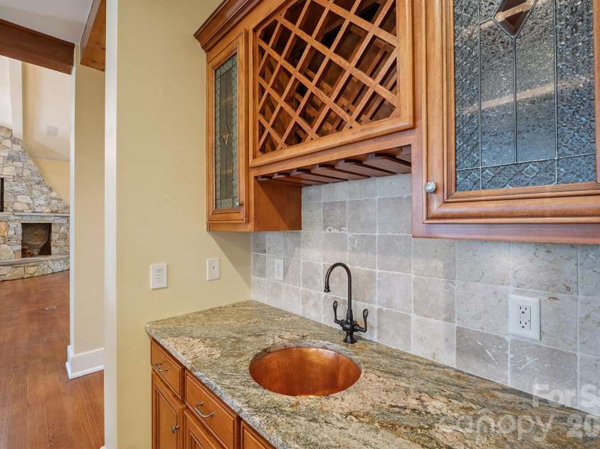1515 Baltusrol Drive, Denver, NC 28037.  MLS# CAR4224856, YatesRealty ID 28621. Charming Wine Bar with Textured Glass Cabinetry and Lovely Round Copper Sink.