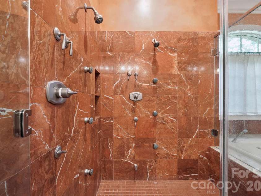 1515 Baltusrol Drive, Denver, NC 28037.  MLS# CAR4224856, YatesRealty ID 28621. Decorative Tile Shower with Massaging Body Jets and Convenient Tile Niches.