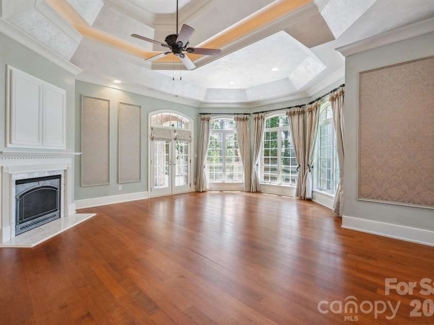 1515 Baltusrol Drive, Denver, NC 28037.  MLS# CAR4224856, YatesRealty ID 28621. European-Style Fabric Wall Coverings and Gas Fireplace in Primary Bedroom.