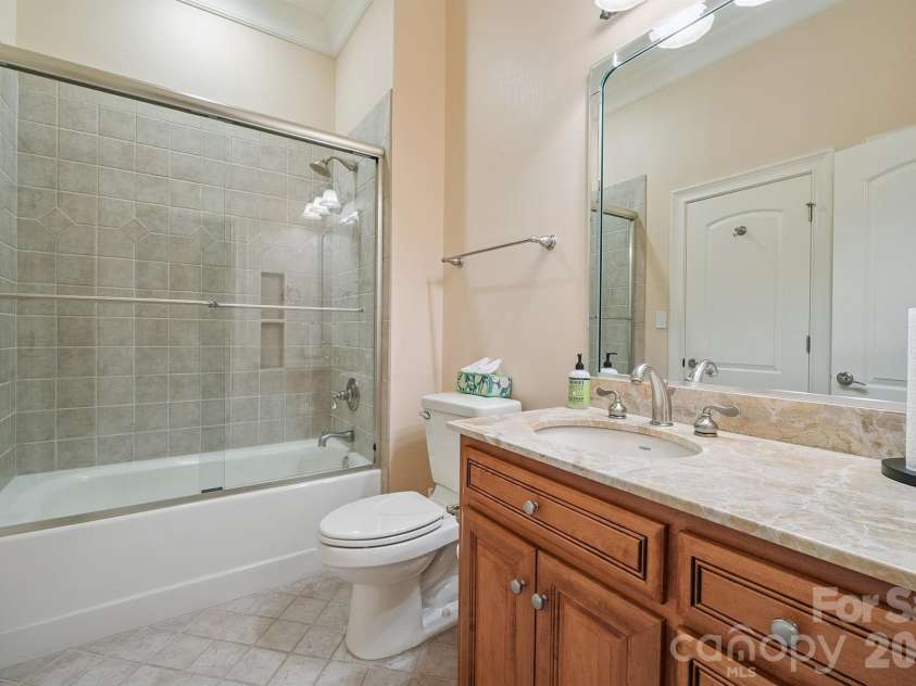 1515 Baltusrol Drive, Denver, NC 28037.  MLS# CAR4224856, YatesRealty ID 28621. Full Guest Bath with Marble Top and Decorative Tile Shower.