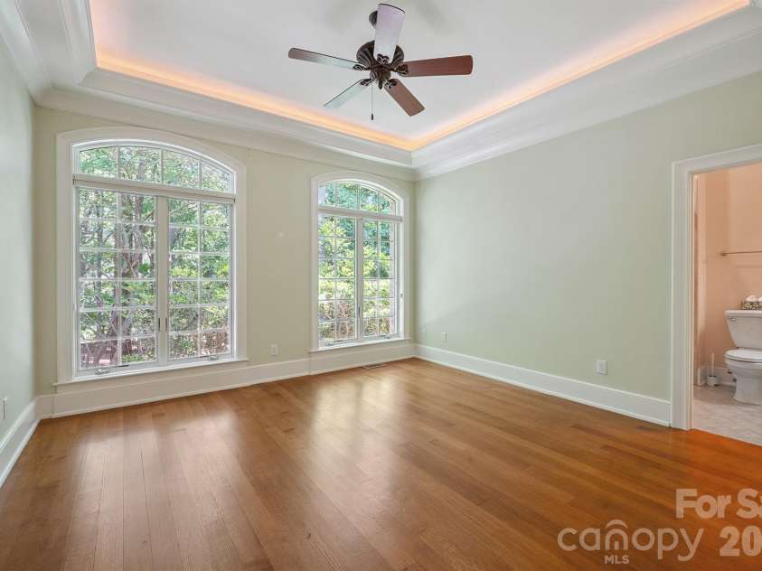 1515 Baltusrol Drive, Denver, NC 28037.  MLS# CAR4224856, YatesRealty ID 28621. Gorgeous Guest Bedroom with Tray Ceiling and Accent Up-Lighting.