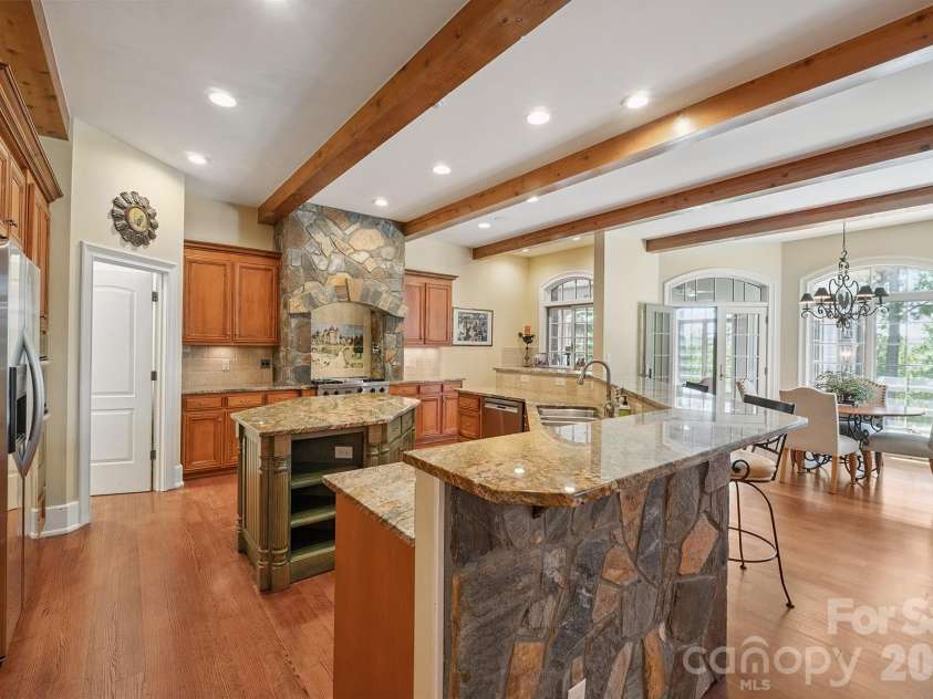 1515 Baltusrol Drive, Denver, NC 28037.  MLS# CAR4224856, YatesRealty ID 28621. Rustic elegance in Kitchen with Exposed Beams and Columns. 