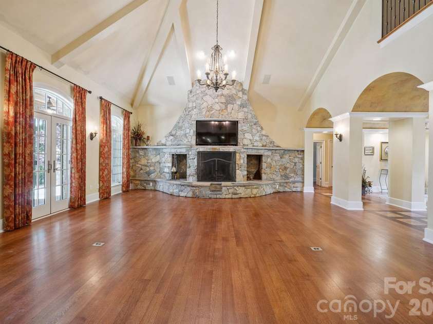 1515 Baltusrol Drive, Denver, NC 28037.  MLS# CAR4224856, YatesRealty ID 28621. Striking Floor-to-Ceiling Natural Stone Fireplace in Great Room with Stone Slab Mantel and Raised Flagstone Hearth.