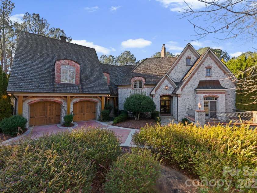1515 Baltusrol Drive, Denver, NC 28037.  MLS# CAR4224856, YatesRealty ID 28621. Stunning French Country Estate with Natural Stone Exterior, Brick Detailing, and Copper Accents.