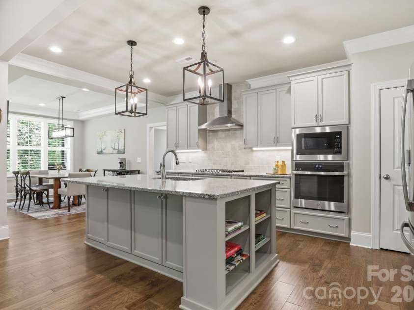 9823 Ardley Park Way, Mint Hill, NC 28227.  MLS# CAR4387355, YatesRealty ID 28629. Breakfast seating in kitchen island