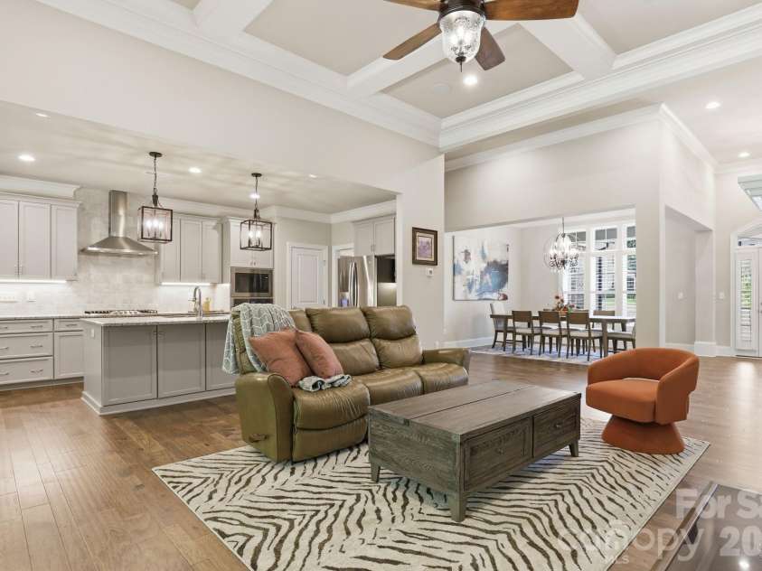 9823 Ardley Park Way, Mint Hill, NC 28227.  MLS# CAR4387355, YatesRealty ID 28629. Great room, kitchen, and dining room