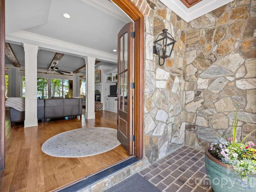 20727 Pointe Regatta Drive, Cornelius, NC 28031.  MLS# CAR4370865, YatesRealty ID 28632. Inviting front entry with stone accents and a welcoming foyer that opens to a light-filled interior.