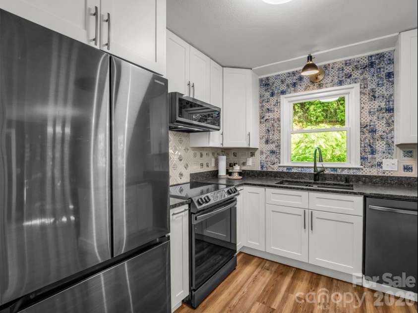 395 Howard Street, Tryon, NC 28782.  MLS# CAR4387885, YatesRealty ID 28635. 