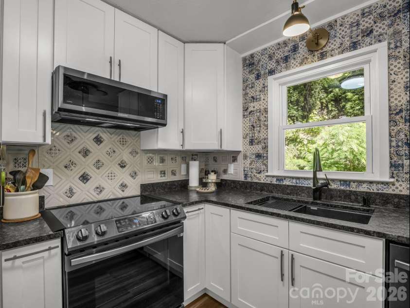 395 Howard Street, Tryon, NC 28782.  MLS# CAR4387885, YatesRealty ID 28635. 