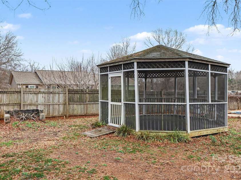 119 Moore Drive, Gastonia, NC 28056.  MLS# CAR4332115, YatesRealty ID 2865. Inviting backyard featuring a screened gazebo, perfect for outdoor entertaining, relaxing, or enjoying peaceful views year-round. 