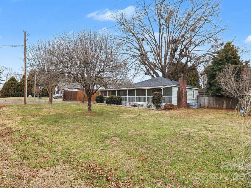 119 Moore Drive, Gastonia, NC 28056.  MLS# CAR4332115, YatesRealty ID 2865. The expansive lawn offers plenty of room for gardening, pets, play, or future enhancements, all framed by mature trees that provide shade and a sense of privacy.