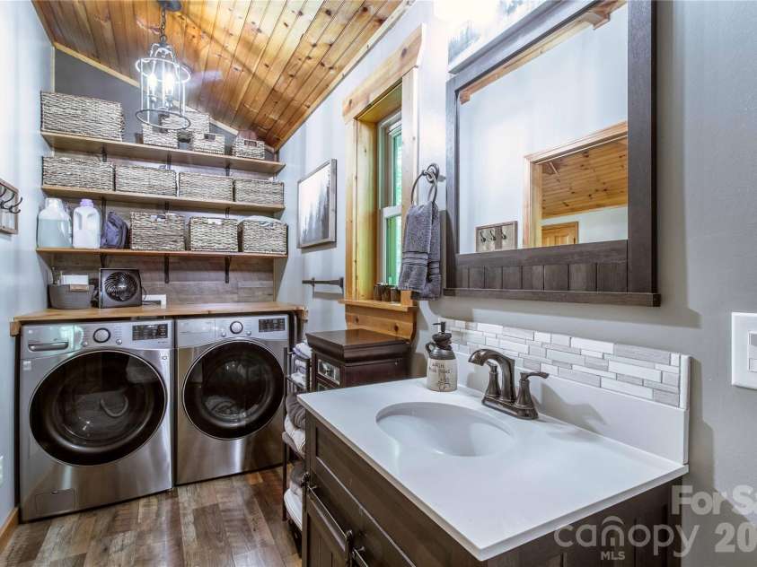 762 Willow Lakes Drive, Rutherfordton, NC 28139.  MLS# CAR4389394, YatesRealty ID 28657. Upper level bath with laundry...full sized washer and dryer