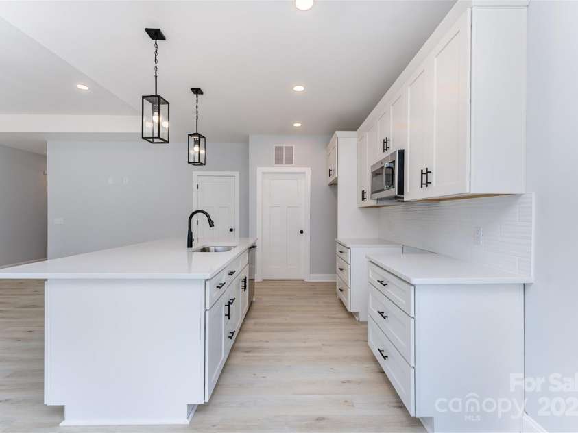 309 Walker Street, Kannapolis, NC 28081.  MLS# CAR4258549, YatesRealty ID 28661. Matching stainless steel electric range & refrigerator installed after photos were taken