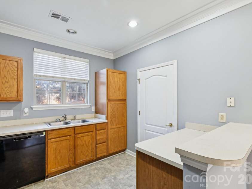 7325 Michaels Landing Drive, Charlotte, NC 28262.  MLS# CAR4330615, YatesRealty ID 28664. Kitchen / Laundry Area