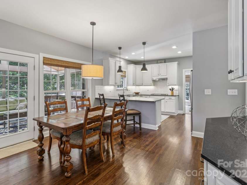 9735 Devonshire Drive, Huntersville, NC 28078.  MLS# CAR4276050, YatesRealty ID 28664. Eating area that leads to the back porch