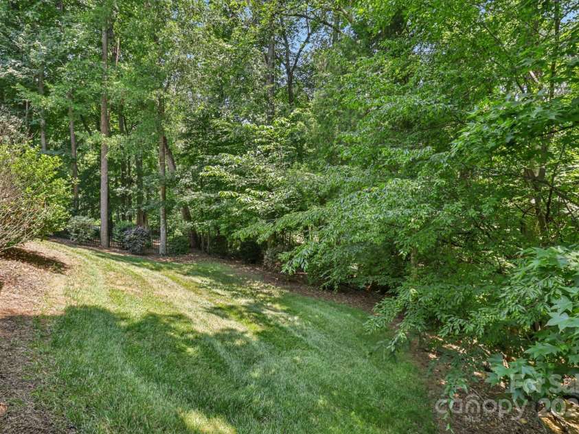 9735 Devonshire Drive, Huntersville, NC 28078.  MLS# CAR4276050, YatesRealty ID 28664. Lush mature trees in the backyard