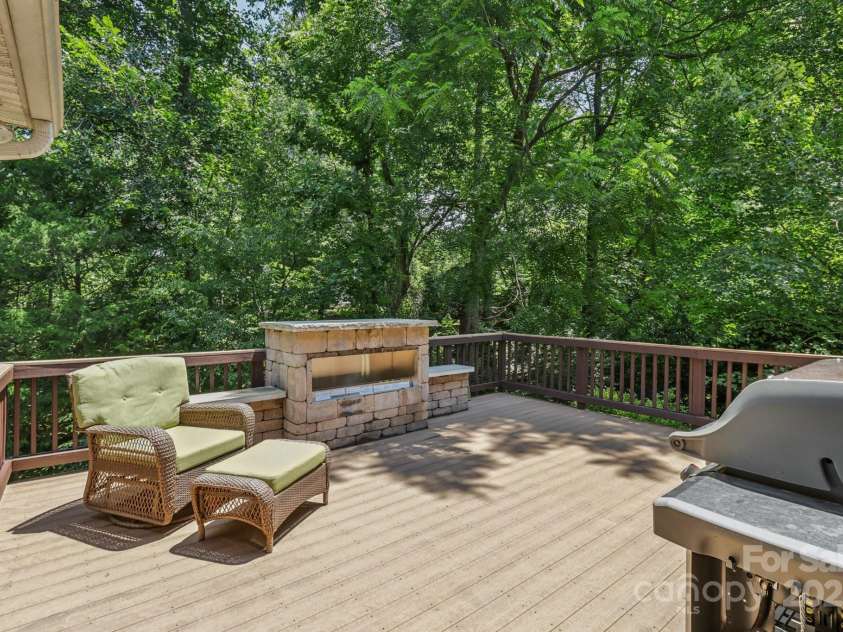 9735 Devonshire Drive, Huntersville, NC 28078.  MLS# CAR4276050, YatesRealty ID 28664. Second deck with a gas fireplace