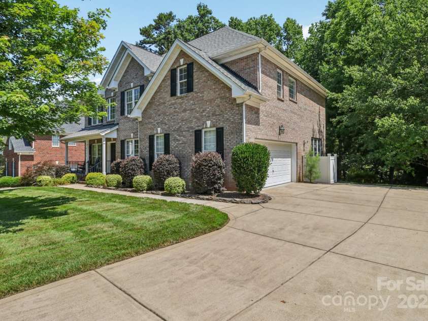 9735 Devonshire Drive, Huntersville, NC 28078.  MLS# CAR4276050, YatesRealty ID 28664. Side load oversized garage
