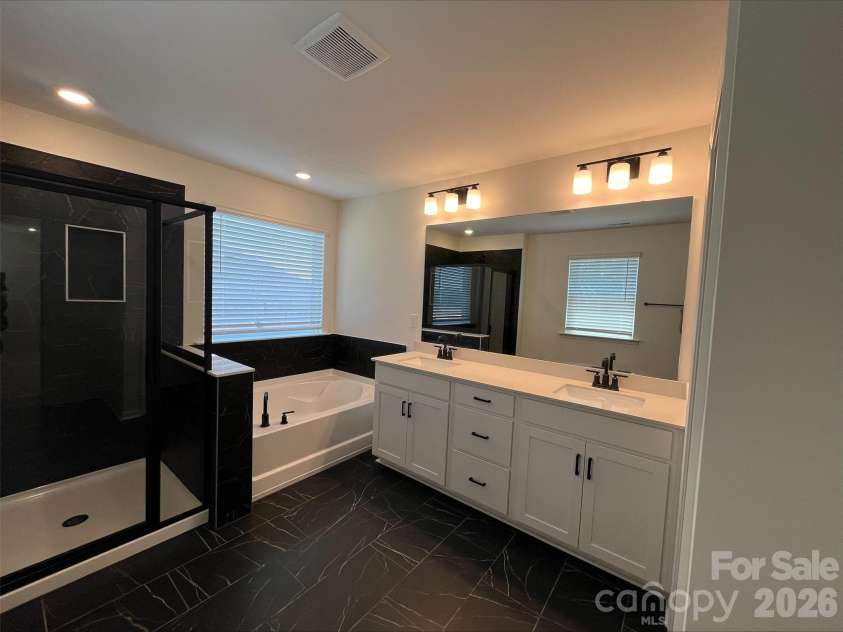 2001 Quiet Woods Road, Monroe, NC 28110.  MLS# CAR4383567, YatesRealty ID 28665. Primary Bathroom