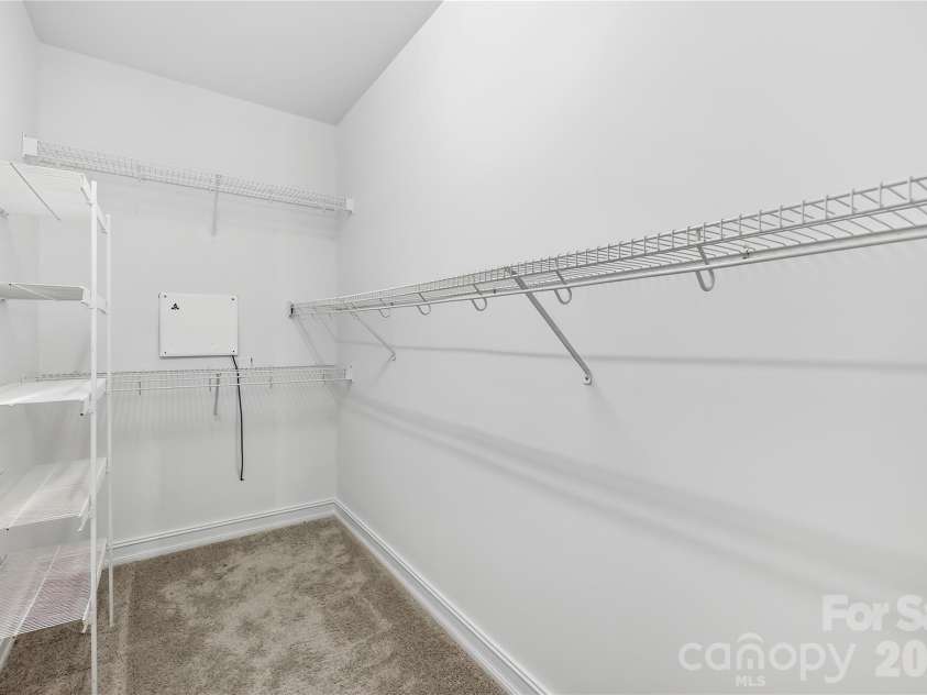 20236 Colony Point Lane, Cornelius, NC 28031.  MLS# CAR4378155, YatesRealty ID 28667. Large Walk-In Closet off Primary Bath Suite