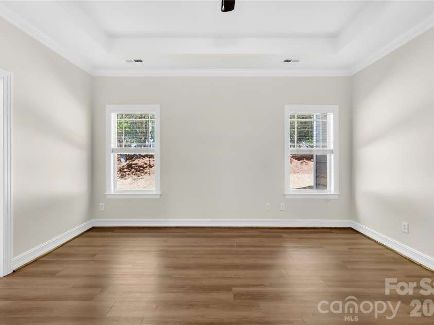 20236 Colony Point Lane, Cornelius, NC 28031.  MLS# CAR4378155, YatesRealty ID 28667. Primary Bedroom on main level with Trey Ceiling and Ceiling Fan
