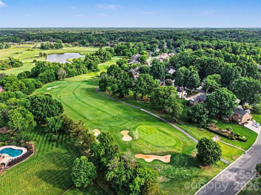 4726 Shannamara Drive, Matthews, NC 28104.  MLS# CAR4383623, YatesRealty ID 28671. The home Hole, 14th at The Divide Golf Course
