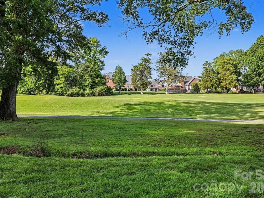 4726 Shannamara Drive, Matthews, NC 28104.  MLS# CAR4383623, YatesRealty ID 28671. View from your yard! 14th green on the Divide Golf course