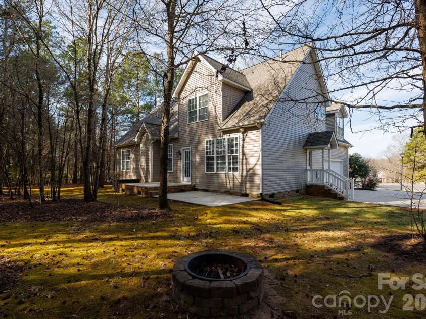 2656 Stonetrace Drive, Rock Hill, SC 29730.  MLS# CAR4338660, YatesRealty ID 28678. House back view with firepit