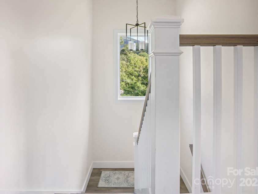 8 Green Tree Lane, Asheville, NC 28805.  MLS# CAR4289236, YatesRealty ID 2868. Wide staircase with mountain views