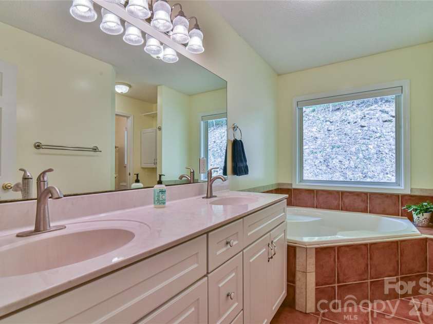 55 Sugar Hill Drive, Weaverville, NC 28787.  MLS# CAR4377617, YatesRealty ID 28681. Primary bath with double sinks.