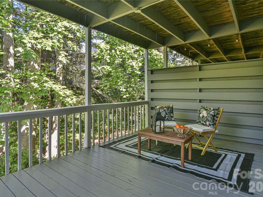63 Hollybrook Drive, Asheville, NC 28803.  MLS# CAR4383971, YatesRealty ID 28682. Lower level deck.