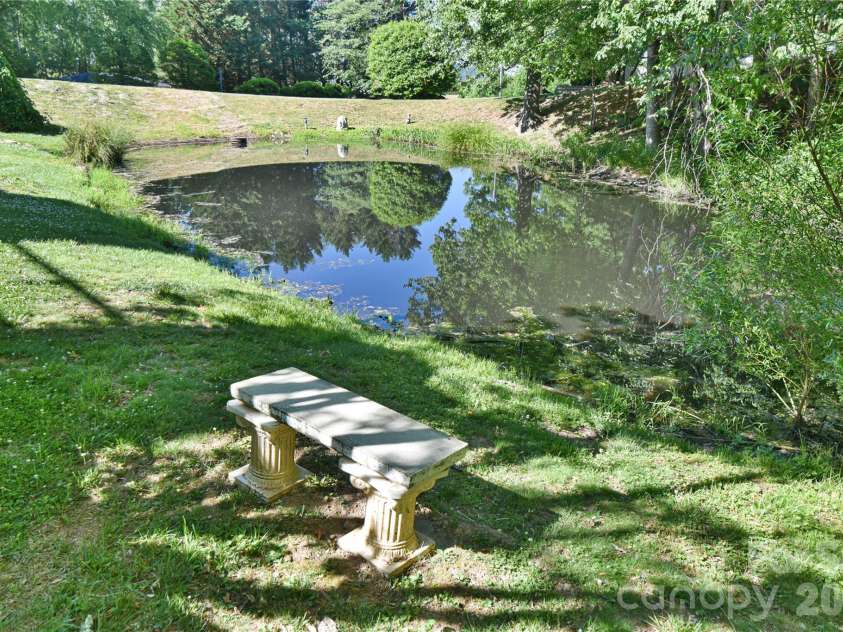 63 Hollybrook Drive, Asheville, NC 28803.  MLS# CAR4383971, YatesRealty ID 28682. Pond view from the lower level deck.