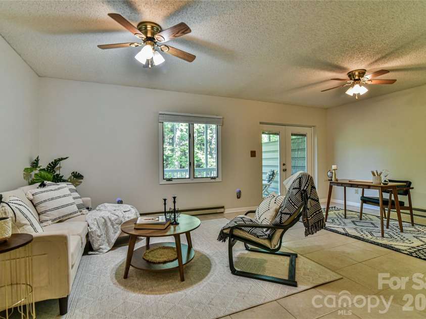 63 Hollybrook Drive, Asheville, NC 28803.  MLS# CAR4383971, YatesRealty ID 28682. Spacious lower level den.