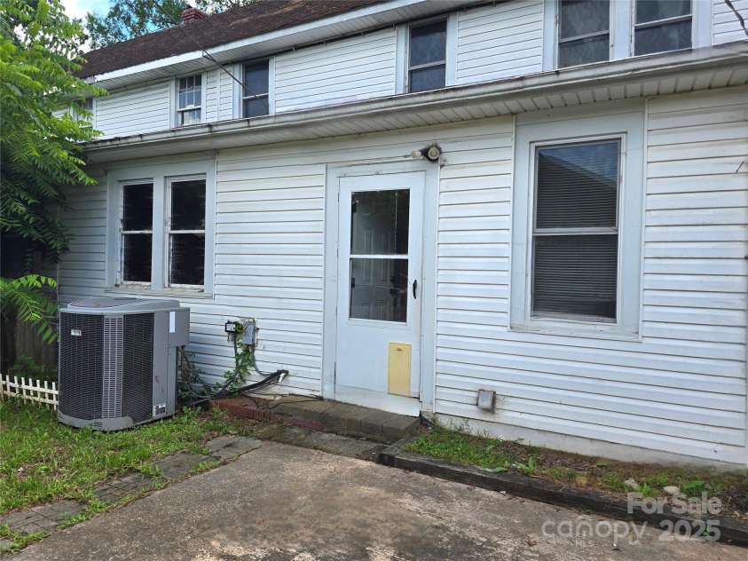 29 Willow Street, Badin, NC 28009.  MLS# CAR4272543, YatesRealty ID 28683. Back door leading to mudroom/laundry room