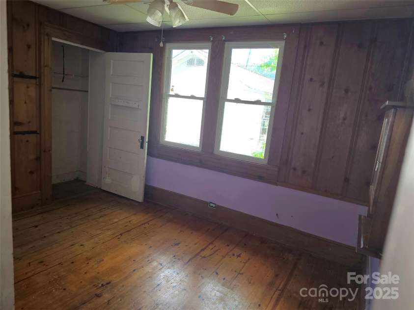 29 Willow Street, Badin, NC 28009.  MLS# CAR4272543, YatesRealty ID 28683. Downstairs bedroom, two entry doors. One from living room by staircase and another into the laundry/mudroom