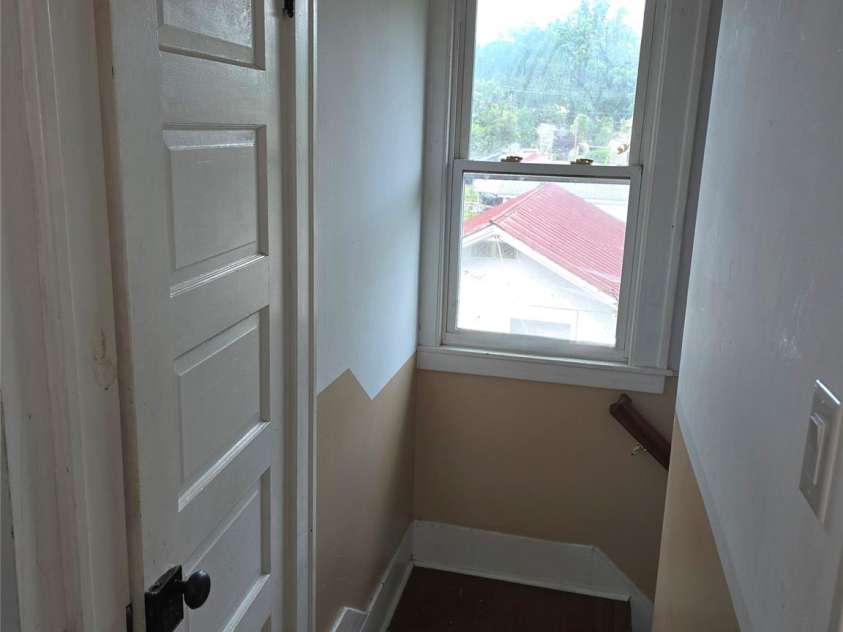 29 Willow Street, Badin, NC 28009.  MLS# CAR4272543, YatesRealty ID 28683. Hallway top of stairs & closet