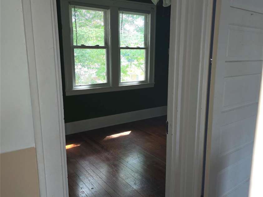 29 Willow Street, Badin, NC 28009.  MLS# CAR4272543, YatesRealty ID 28683. Top of stairs leading into 2nd bedroom