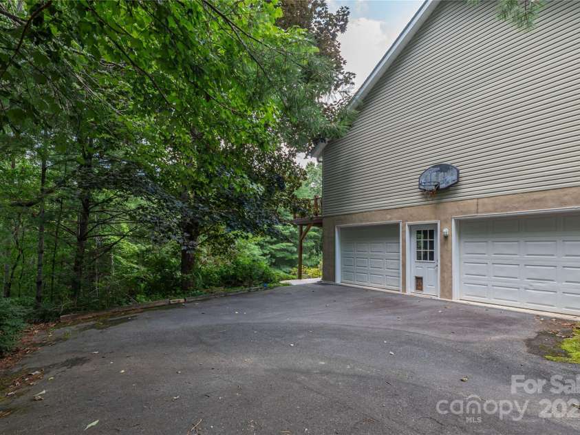 24 Moriah Lane, Asheville, NC 28803.  MLS# CAR4277809, YatesRealty ID 28686. Basement garages