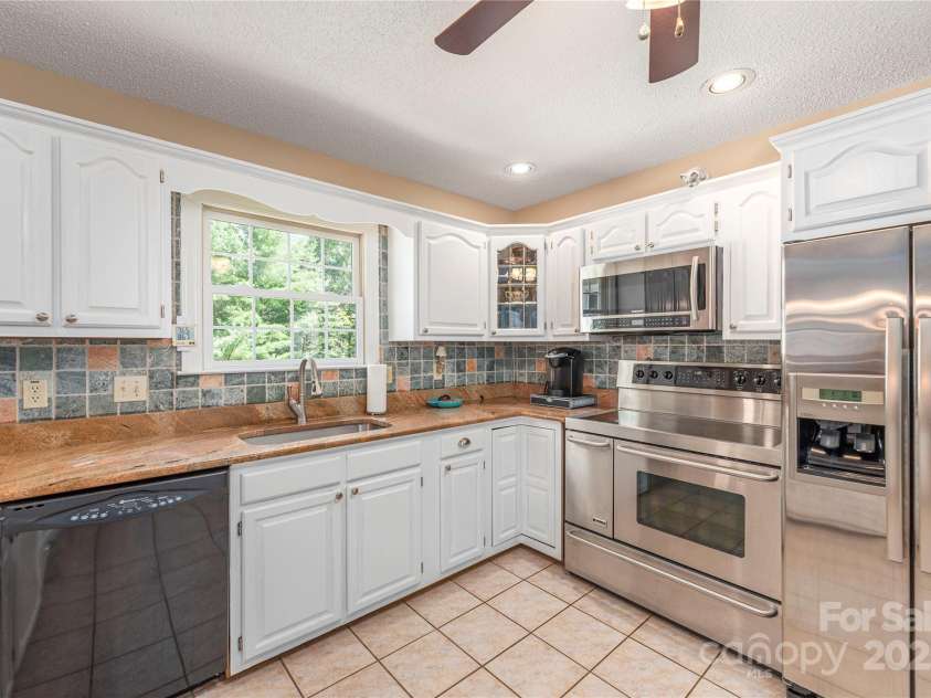 24 Moriah Lane, Asheville, NC 28803.  MLS# CAR4277809, YatesRealty ID 28686. Fabulous kitchen overlooks private backyard