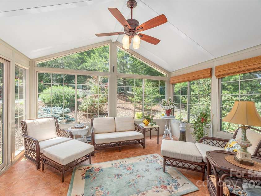 24 Moriah Lane, Asheville, NC 28803.  MLS# CAR4277809, YatesRealty ID 28686. Front sunroom is heated