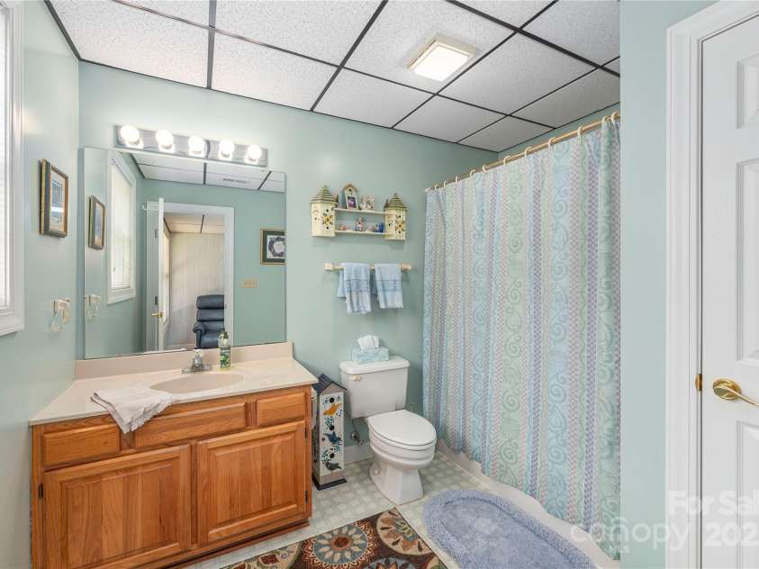 24 Moriah Lane, Asheville, NC 28803.  MLS# CAR4277809, YatesRealty ID 28686. Secondary full bathroom in basement