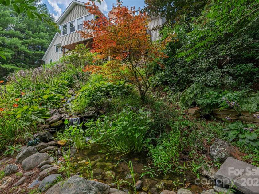 24 Moriah Lane, Asheville, NC 28803.  MLS# CAR4277809, YatesRealty ID 28686. Sweet waterfall to enjoy