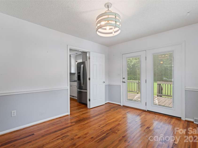 110 Log Barn Road, Salisbury, NC 28146.  MLS# CAR4282136, YatesRealty ID 28692. DINING ROOM FLOWS TO THE KITCHEN AND TO THE SPACIOUS DECK