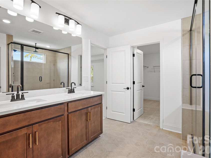 1210 Chasity Trails Court, Matthews, NC 28104.  MLS# CAR4387944, YatesRealty ID 28693. Primary bathroom