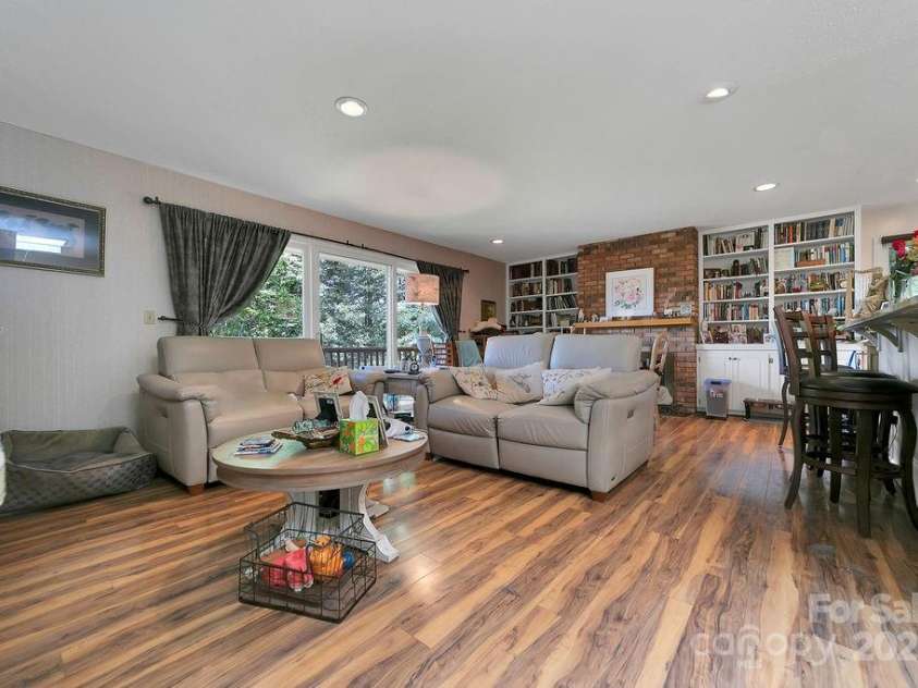 1315 Glen Cannon Drive, Pisgah Forest, NC 28768.  MLS# CAR4282131, YatesRealty ID 28696. Den Open to Kitchen and Dining Area