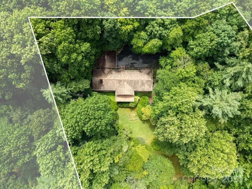 1315 Glen Cannon Drive, Pisgah Forest, NC 28768.  MLS# CAR4282131, YatesRealty ID 28696. Nestled in Wooded Privacy