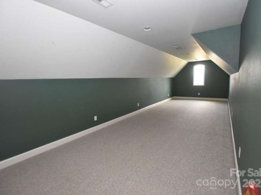 111 Springwood Drive, Valdese, NC 28690.  MLS# CAR4232426, YatesRealty ID 2870. Family Room over Garage