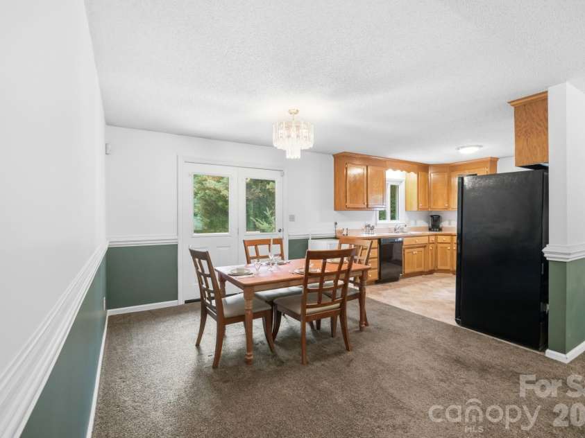 1037 Wilkerson Street, Belmont, NC 28012.  MLS# CAR4370201, YatesRealty ID 28702. Dining area opens into kitchen and also to the back deck.