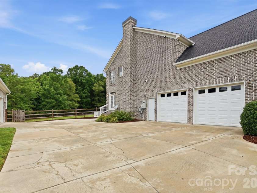 4561 Chanel Court, Concord, NC 28025.  MLS# CAR4384663, YatesRealty ID 28709. 2 car side load garage